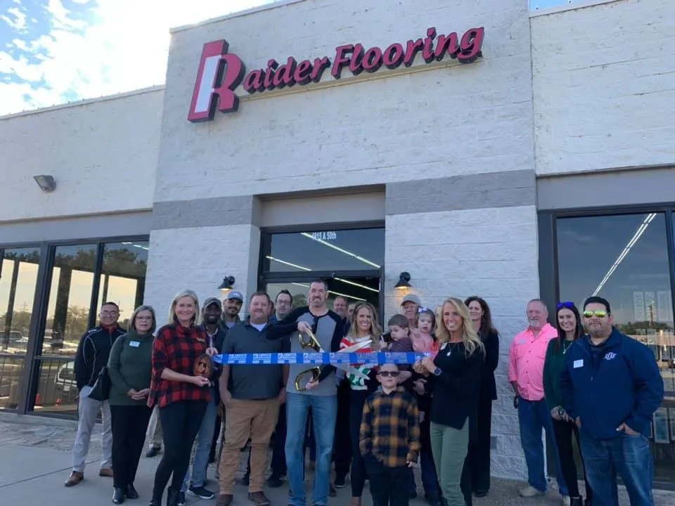 Ribbon cutting in front of showroom | Raider Flooring