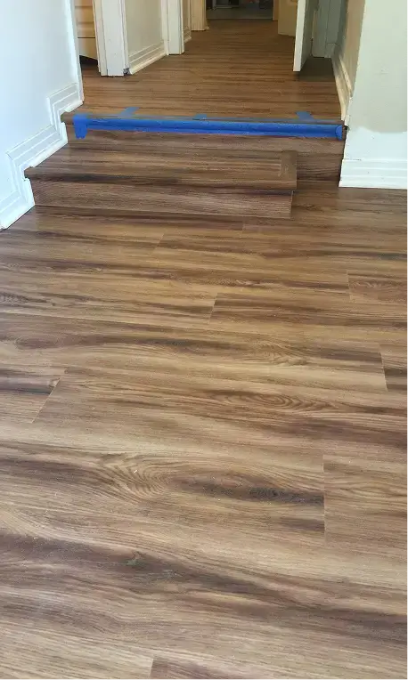 rustic wood tones displayed through laminate flooring service in lubbock tx in contemporary interior flooring design