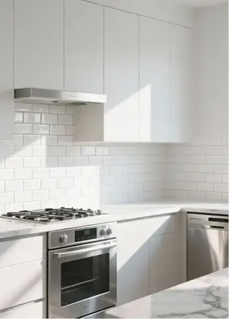 Glossy or semi-gloss slab-front white cabinets maximizing vertical storage