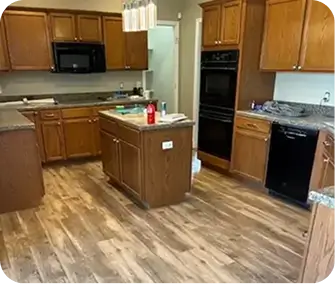 Upper and lower honey-oak wood cabinets with traditional arched panel doors